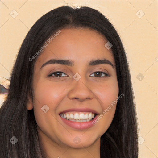 Joyful latino young-adult female with long  brown hair and brown eyes