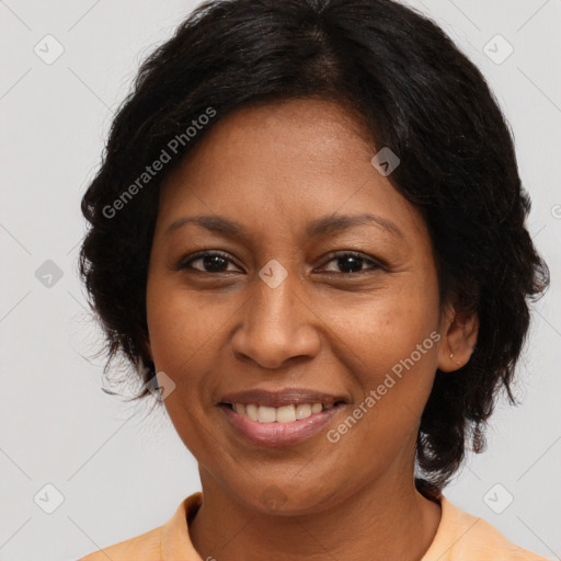 Joyful black adult female with medium  brown hair and brown eyes