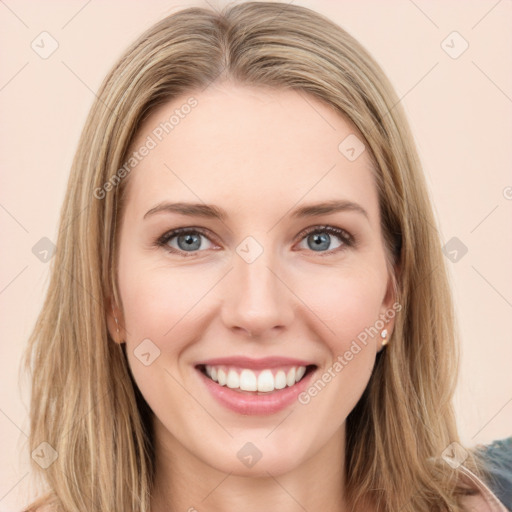 Joyful white young-adult female with long  brown hair and green eyes