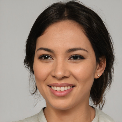Joyful asian young-adult female with medium  brown hair and brown eyes