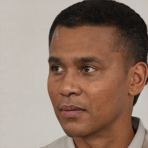 Neutral black young-adult male with short  brown hair and brown eyes