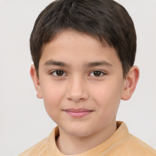 Joyful white child male with short  brown hair and brown eyes