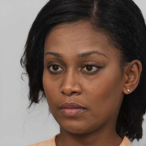 Neutral black young-adult female with long  black hair and brown eyes