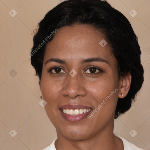 Joyful black young-adult female with short  brown hair and brown eyes