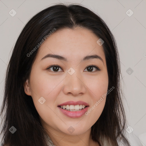 Joyful asian young-adult female with long  brown hair and brown eyes