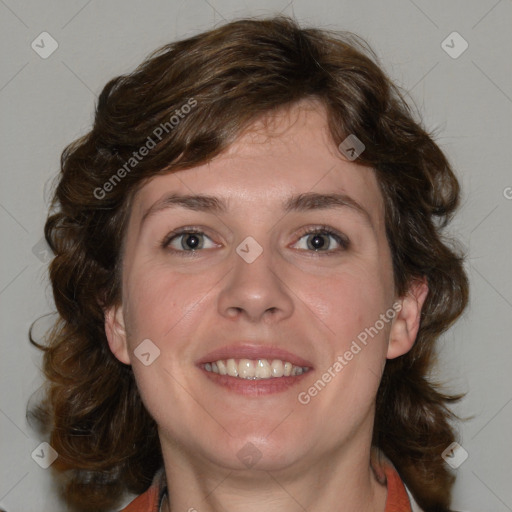 Joyful white adult female with medium  brown hair and blue eyes