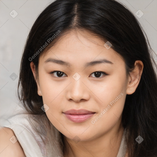 Joyful asian young-adult female with long  brown hair and brown eyes