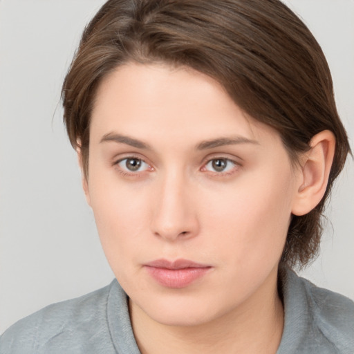 Neutral white young-adult female with medium  brown hair and grey eyes