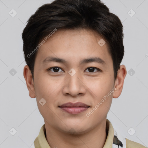 Joyful asian young-adult male with short  brown hair and brown eyes