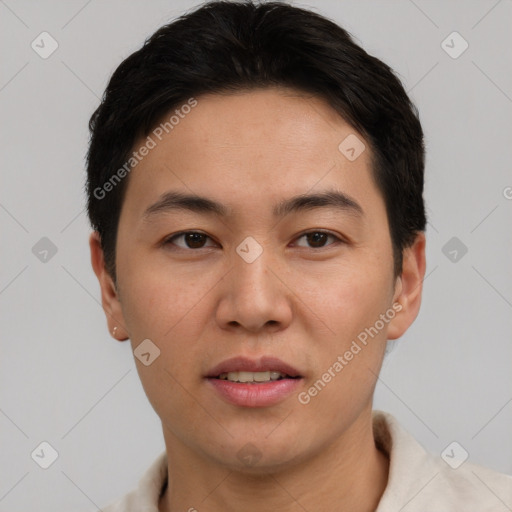 Joyful asian young-adult male with short  brown hair and brown eyes