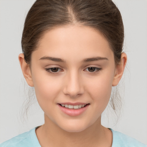 Joyful white child female with medium  brown hair and brown eyes