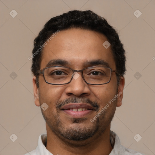 Joyful latino adult male with short  black hair and brown eyes