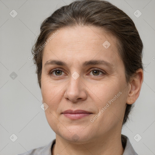 Joyful white adult female with short  brown hair and brown eyes