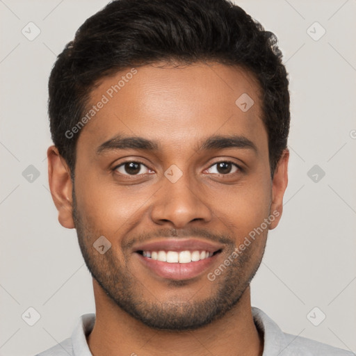 Joyful black young-adult male with short  brown hair and brown eyes