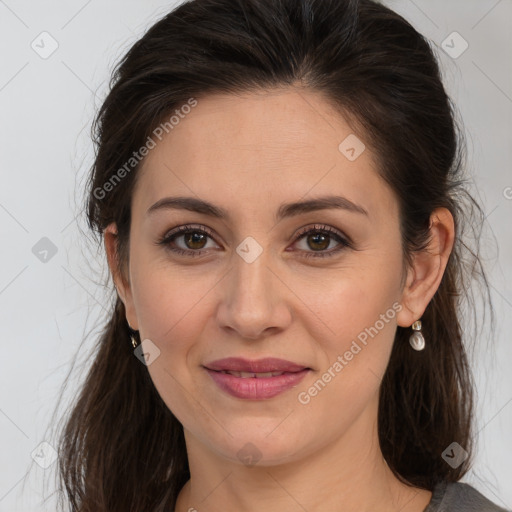 Joyful white adult female with medium  brown hair and brown eyes