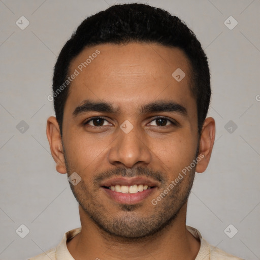 Joyful latino young-adult male with short  black hair and brown eyes