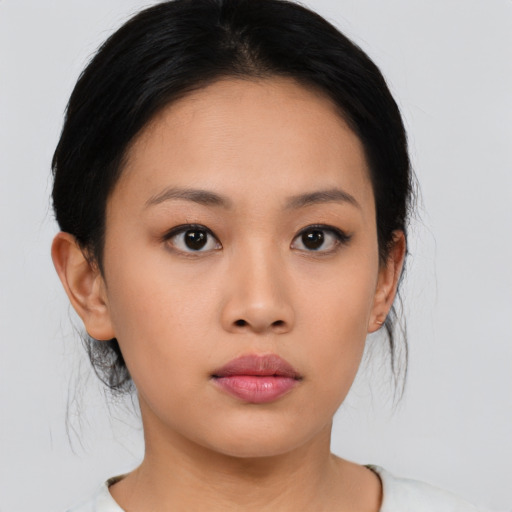 Neutral asian young-adult female with medium  black hair and brown eyes