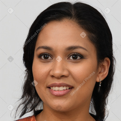 Joyful latino young-adult female with medium  brown hair and brown eyes