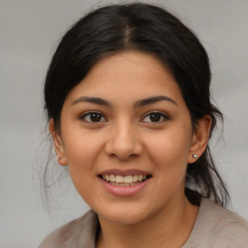 Joyful asian young-adult female with medium  brown hair and brown eyes
