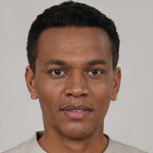 Neutral black young-adult male with short  black hair and brown eyes