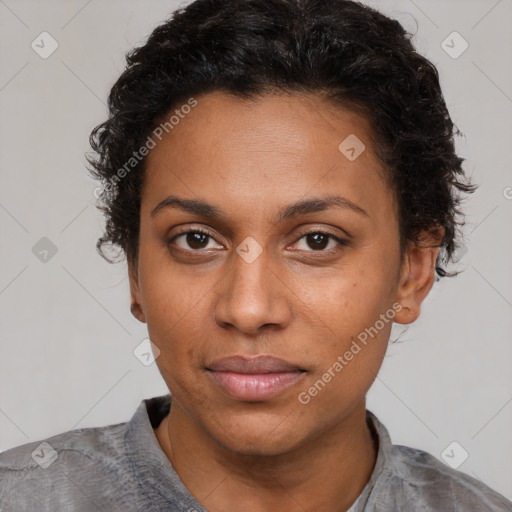 Joyful black young-adult female with short  brown hair and brown eyes