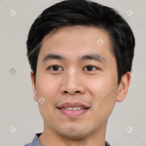 Joyful white young-adult male with short  black hair and brown eyes