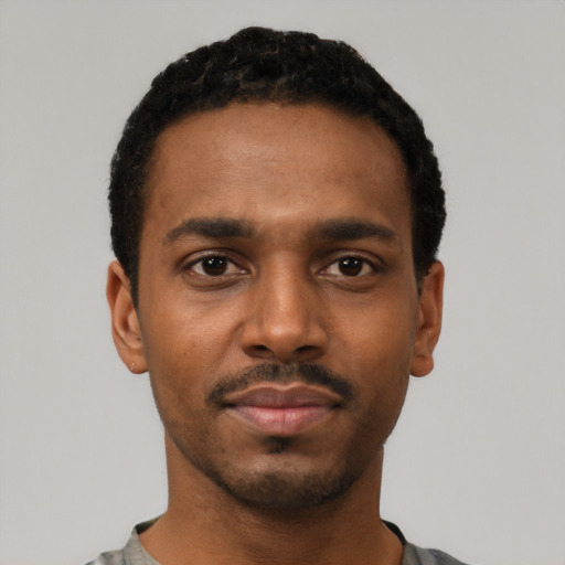 Neutral black young-adult male with short  black hair and brown eyes