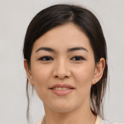 Joyful asian young-adult female with medium  brown hair and brown eyes