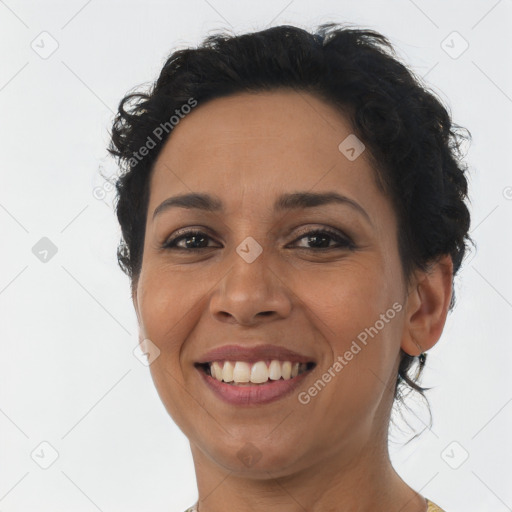 Joyful latino young-adult female with short  brown hair and brown eyes