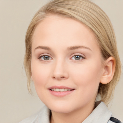 Joyful white young-adult female with medium  brown hair and blue eyes