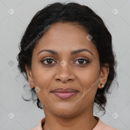 Joyful black adult female with medium  brown hair and brown eyes