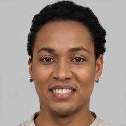 Joyful latino young-adult female with short  black hair and brown eyes