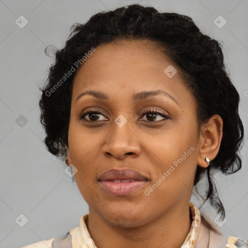 Joyful black adult female with medium  brown hair and brown eyes