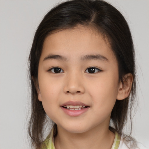 Joyful white child female with medium  brown hair and brown eyes