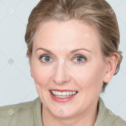 Joyful white adult female with medium  brown hair and blue eyes