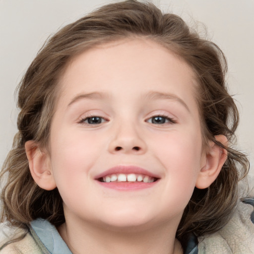 Joyful white child female with medium  brown hair and blue eyes