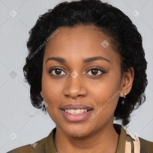 Joyful black young-adult female with short  black hair and brown eyes