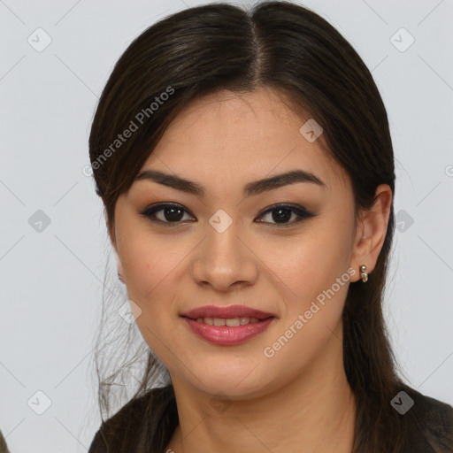 Joyful latino young-adult female with long  brown hair and brown eyes