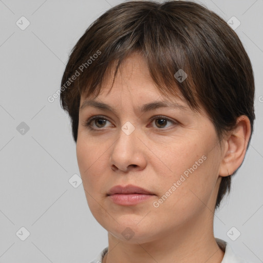 Joyful white adult female with short  brown hair and brown eyes