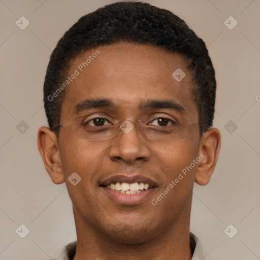 Joyful black young-adult male with short  brown hair and brown eyes