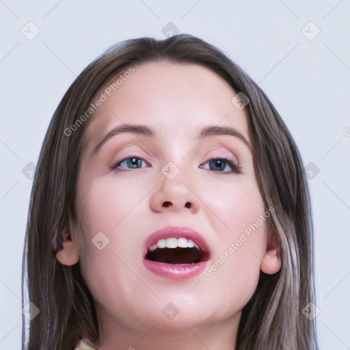 Joyful white young-adult female with long  brown hair and blue eyes