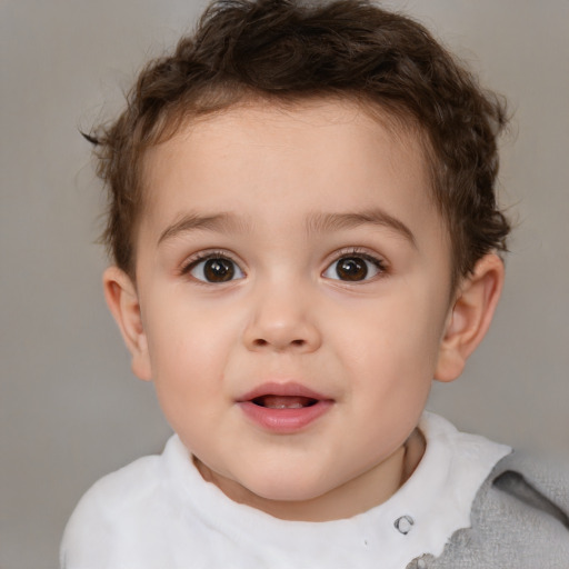 Joyful white child male with short  brown hair and brown eyes