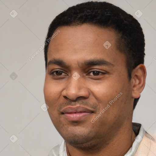 Joyful latino young-adult male with short  black hair and brown eyes