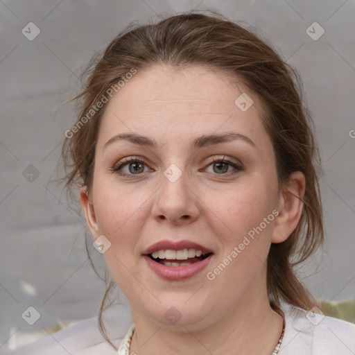 Joyful white adult female with medium  brown hair and grey eyes