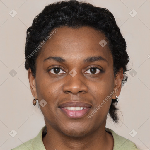 Joyful black young-adult female with short  black hair and brown eyes