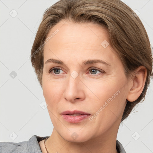 Joyful white adult female with short  brown hair and brown eyes