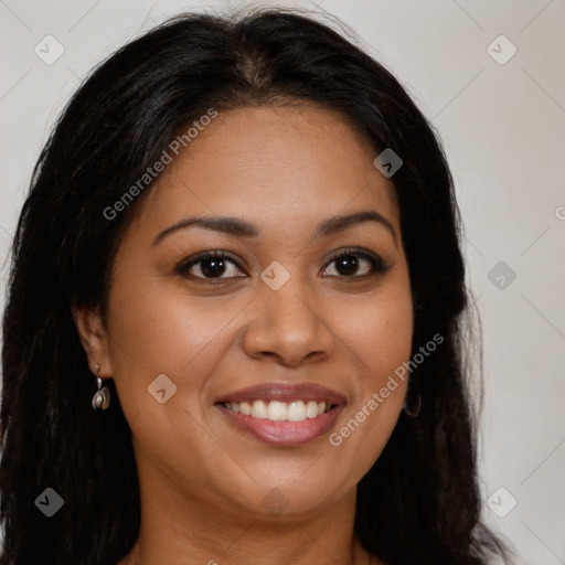 Joyful latino young-adult female with long  brown hair and brown eyes