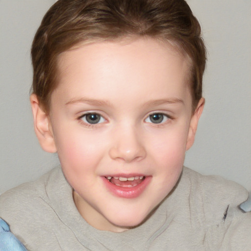 Joyful white child female with short  brown hair and blue eyes