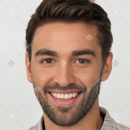 Joyful white young-adult male with short  black hair and brown eyes