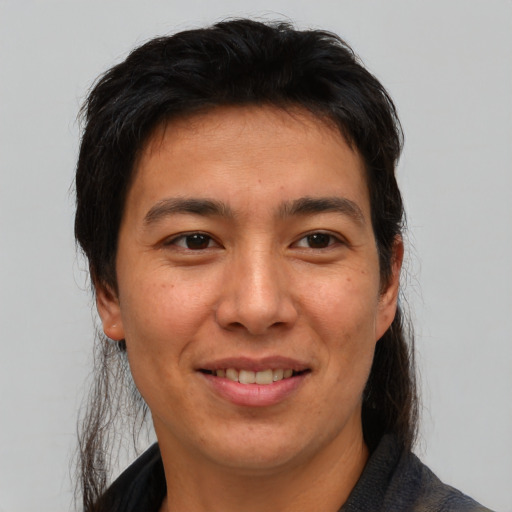 Joyful asian adult female with short  brown hair and brown eyes